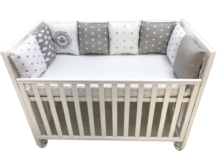 Бортики набори - Комплект м'яких та безпечних бортиків для дитячого ліжечка, що забезпечує захист та комфорт немовляті."